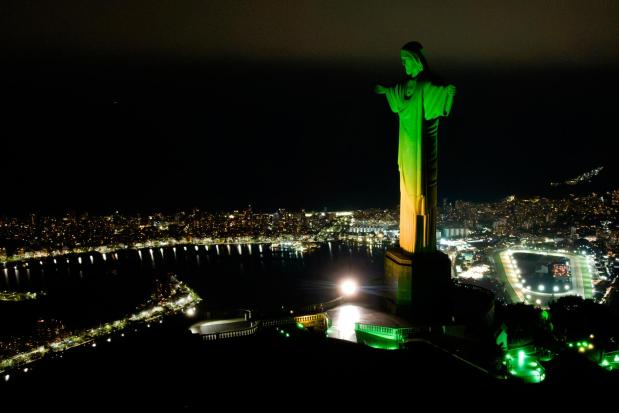 Christ the Redeemer monument is illuminated in Brazil's national colors as part of the countdown to the 2027 FIFA Women's World Cup, in Rio de Janeiro, Brazil, Tuesday, June 23, 2026. (AP Photo/Dhavid Normando)