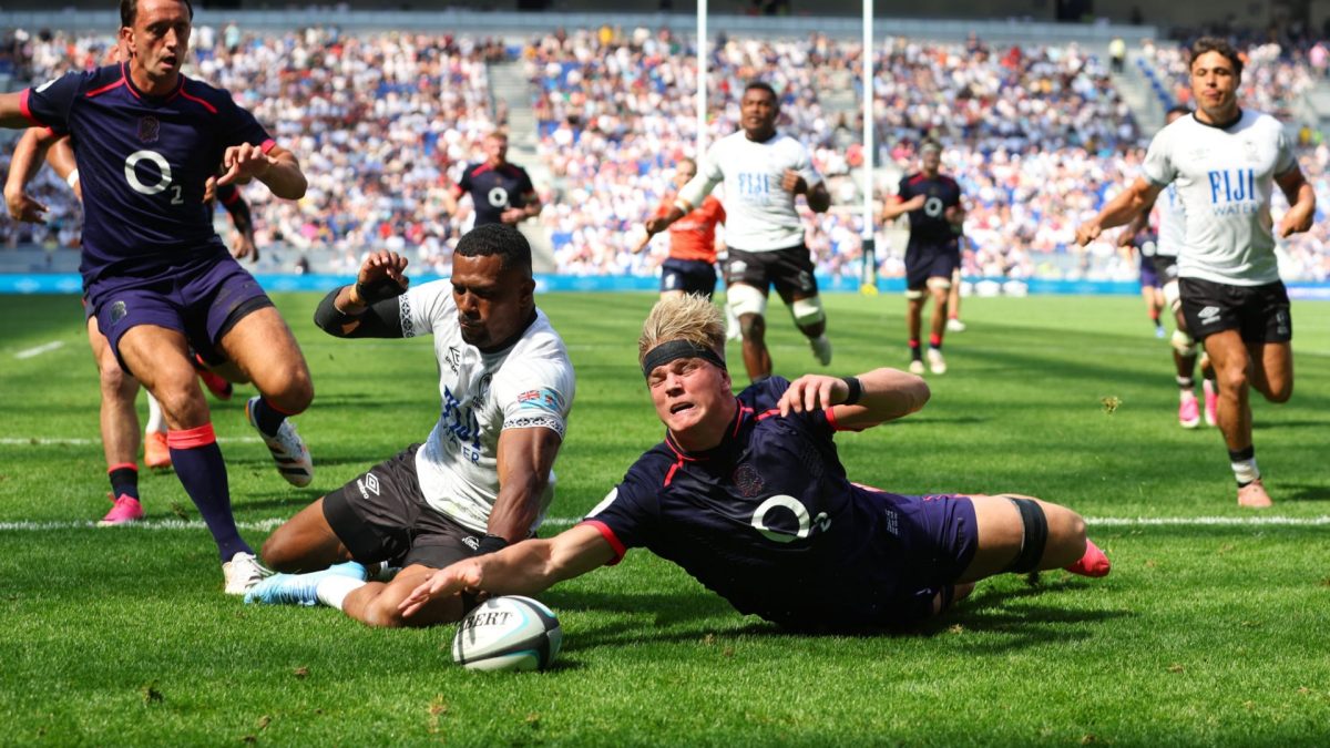 LIVERPOOL, ENGLAND - JULY 11: Henry Pollock of England scores his team's seventh try while under pressure from Jiuta Wainiqolo of Fiji during the 2026 Nations Championship match between Fiji and England at Hill Dickinson Stadium on July 11, 2026 in Liverpool, England. (Photo by Ed Sykes/Getty Images)