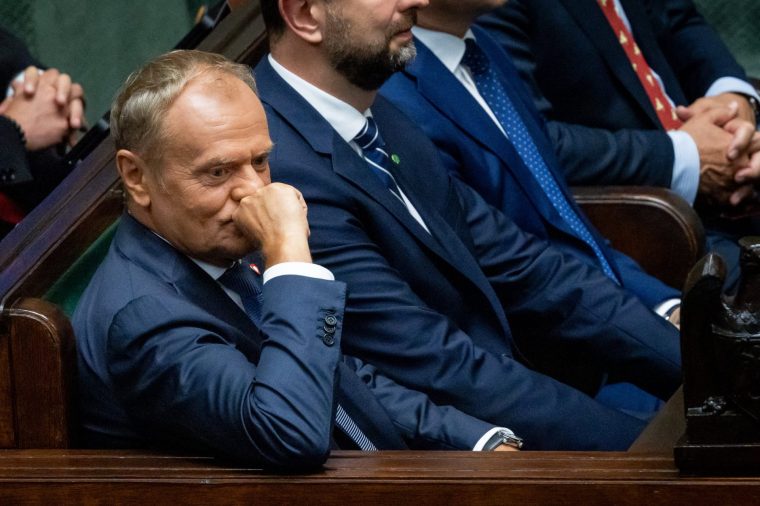 Poland's Prime Minister Donald Tusk attends a session at Poland's parliament, the Sejm, in Warsaw, as Poland's new President is sworn in on August 6, 2025. Poland's incoming new pro-Trump, nationalist president was setting the scene for major confrontation with a prime minister whose government he has branded "the worst in history". Karol Nawrocki, a political novice, is inaugurated after winning a June 1, 2025 election in a major blow for Prime Minister Donald Tusk's pro-EU government. (Photo by Wojtek RADWANSKI / AFP) (Photo by WOJTEK RADWANSKI/AFP via Getty Images)
