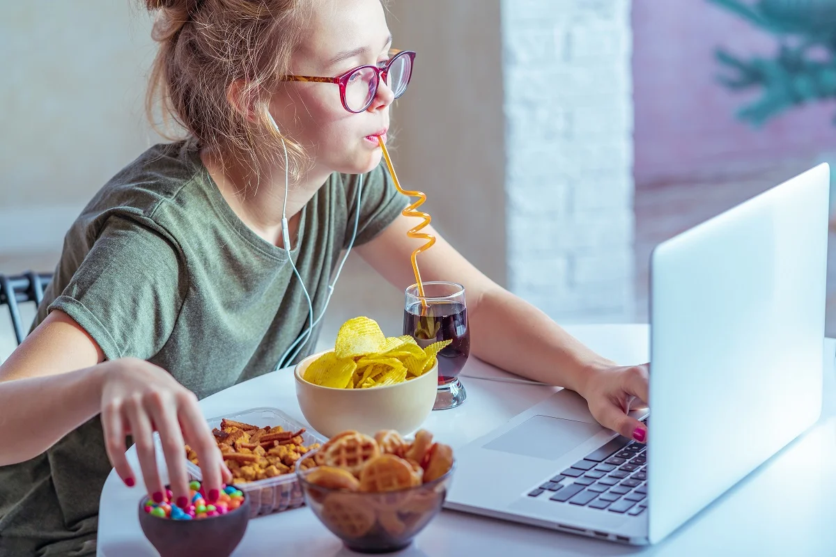 Girl eating junk food