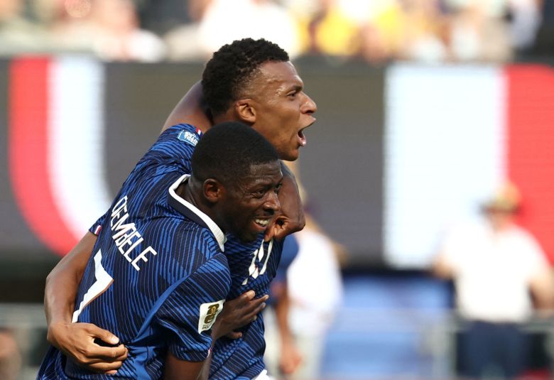 Mbappé (right) celebrates scoring his team's first goal with Ousmane Dembélé during the 2026 World Cup Round of 32 match between France and Sweden on June 30.
