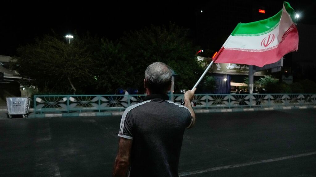 U.S. strikes Iran over latest ship attack A pro-government demonstrator waves an Iranian flag in a gathering commemorating the late Iranian Supreme Leader Ayatollah Ali Khamenei at a square in Tehran, Iran, Saturday, July 11, 2026. (AP Photo/Vahid Salemi)