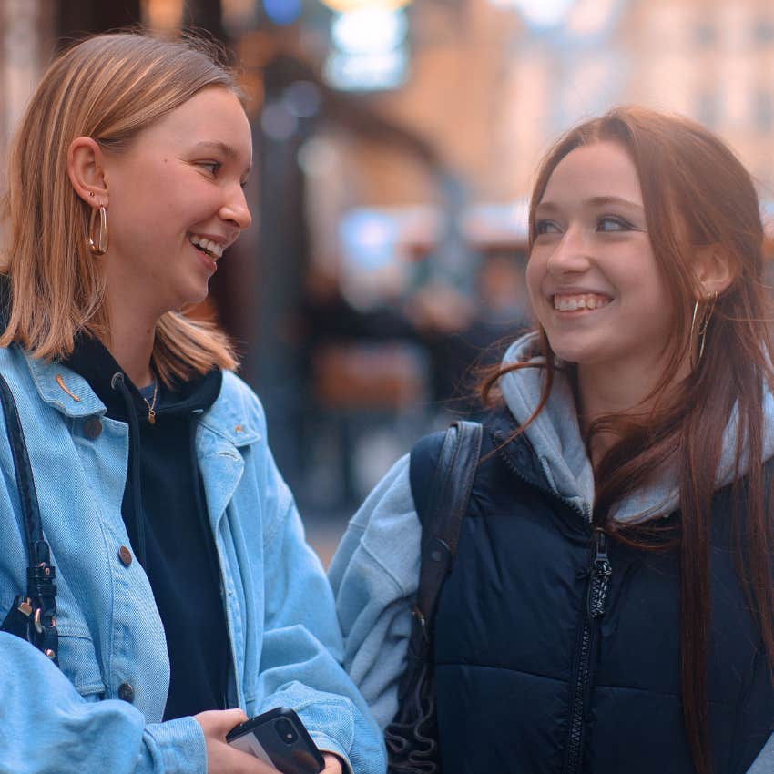 two danish girls having a safe conversations on the streets of copenhagen