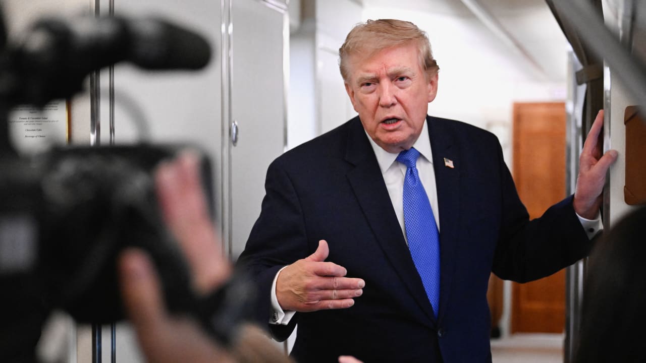 US President Donald Trump speaks to the media aboard Air Force One en route to Joint Base Andrews, in Maryland, US, August 2, 2026. 