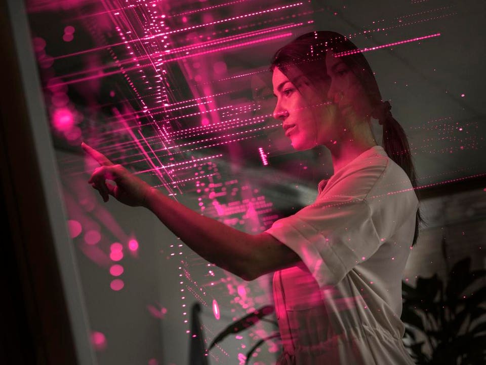 Young scientist examining and using screen of AI technology