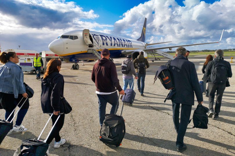 Ryanair passengers boarding a B737 airplane at Malta International Airport, Luqa
