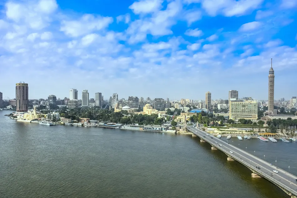 Cairo city skyline with Nile river waterfront, "6 of October bridge" and Cairo Tower on Zamalek district of "Gezira island" (with Giza pyramids visible in the background as a bonus) in Cairo, Egypt.
Image used for illustrative purpose. 
Image courtesy: Getty Images/ Sir Francis Canker Photography