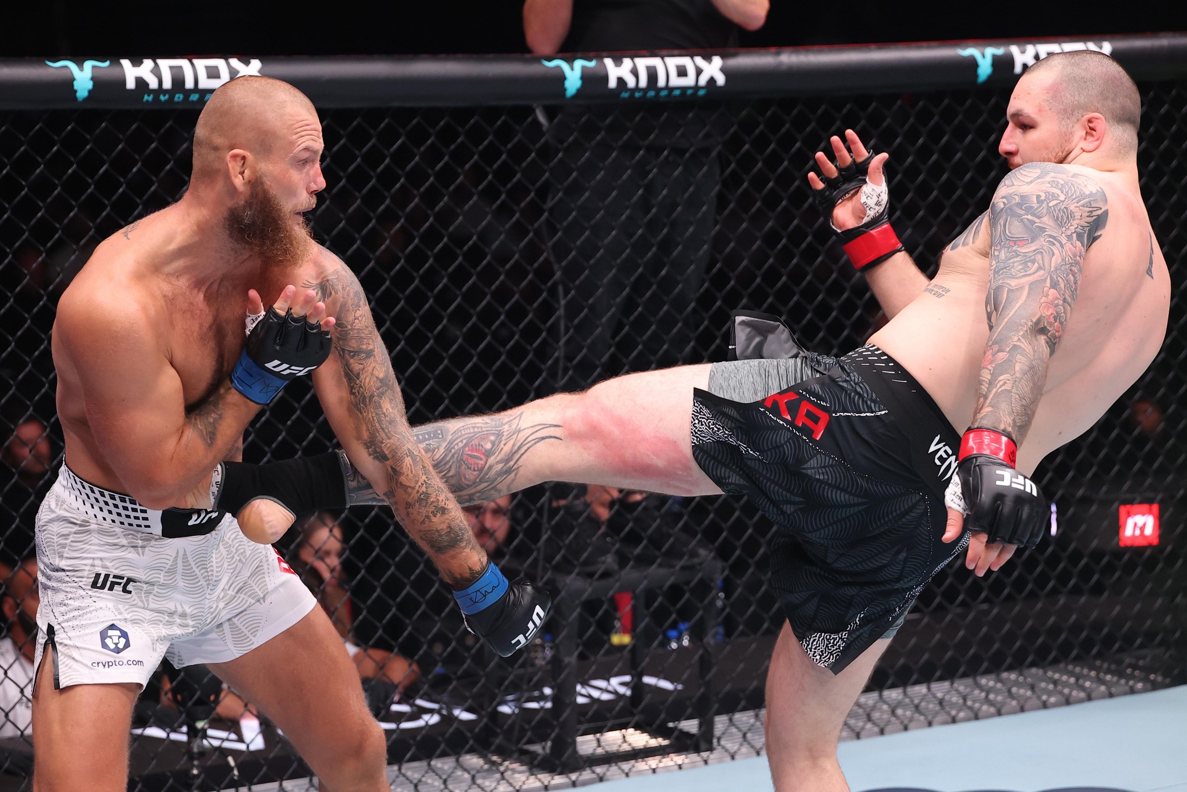 BELGRADE, SERBIA - AUGUST 01: (R-L) Jovan Leka of Serbia kicks Alexander Poppeck of Germany in a heavyweight fight during the UFC Fight Night event at Belgrade Arena on August 01, 2026 in Belgrade, Serbia. (Photo by Ed Mulholland/Zuffa LLC)