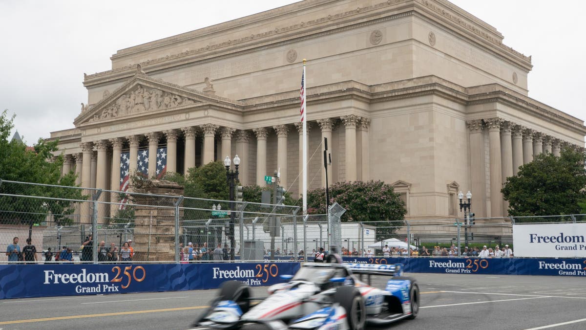 Spectators watch an IndyCar practice run in Washington, D.C.