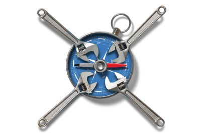 An illustration of four adjustable wrenches arranged in an "X" shape over a blue compass face.