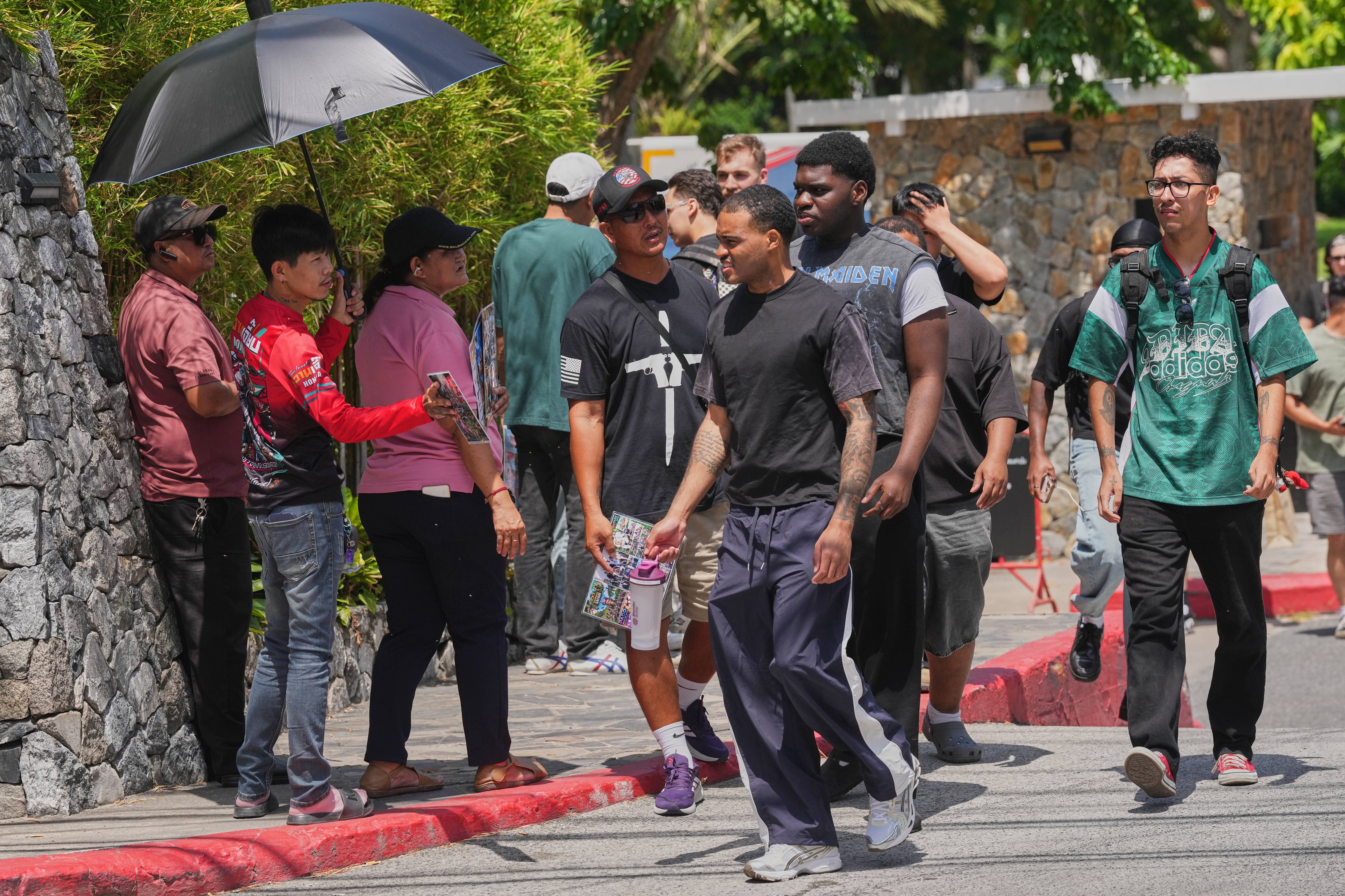 Crew members of the USS Abraham Lincoln leave a hotel in Pattaya, Thailand