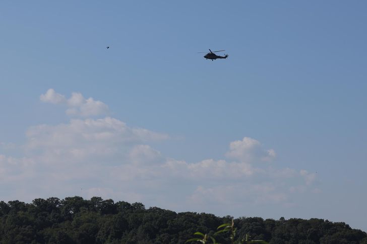 A military helicopter flies over the southern side of the Demilitarized Zone, the heavily fortified border separating North and South Korea, in this photo taken Tuesday.  Yonhap