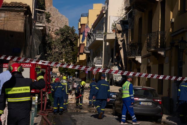 Firefighters work at the scene 