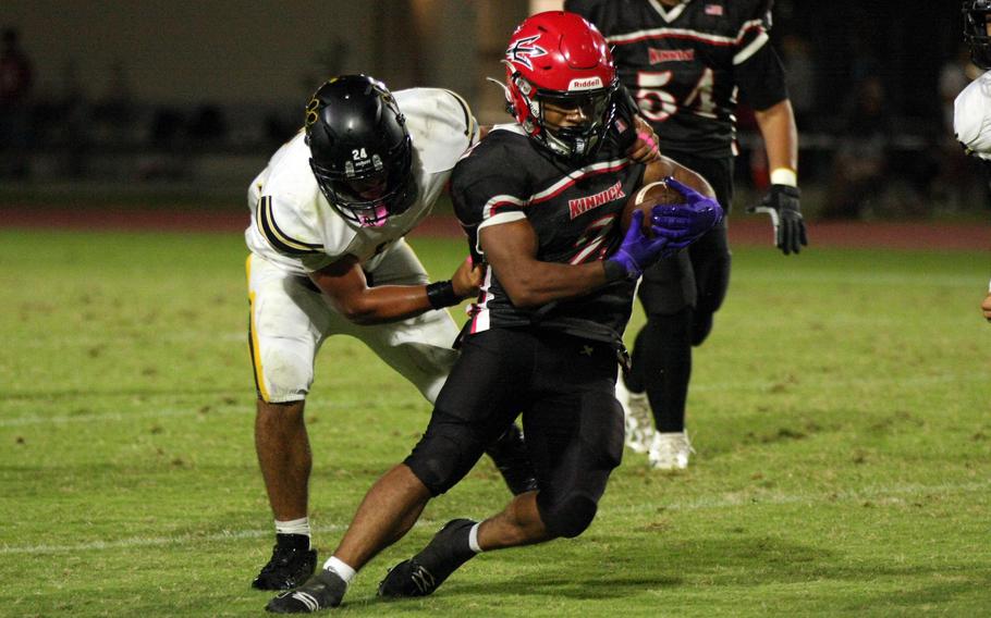 Rico Myhand tries to avoid a tackle.