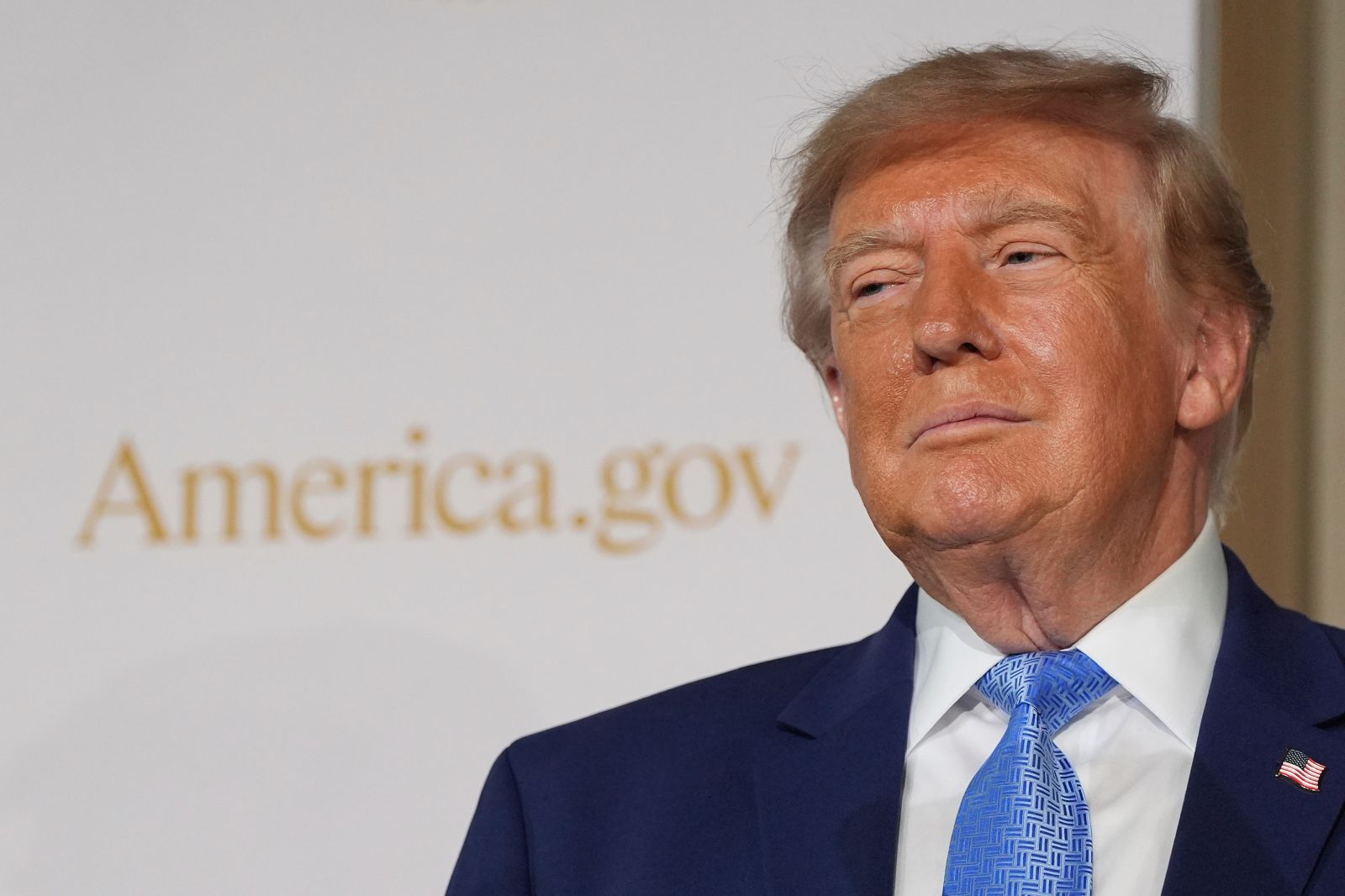 President Donald Trump stands on stage at the Andrew W. Mellon Auditorium on Tuesday in Washington, D.C. (AP Photo/Alex Brandon)