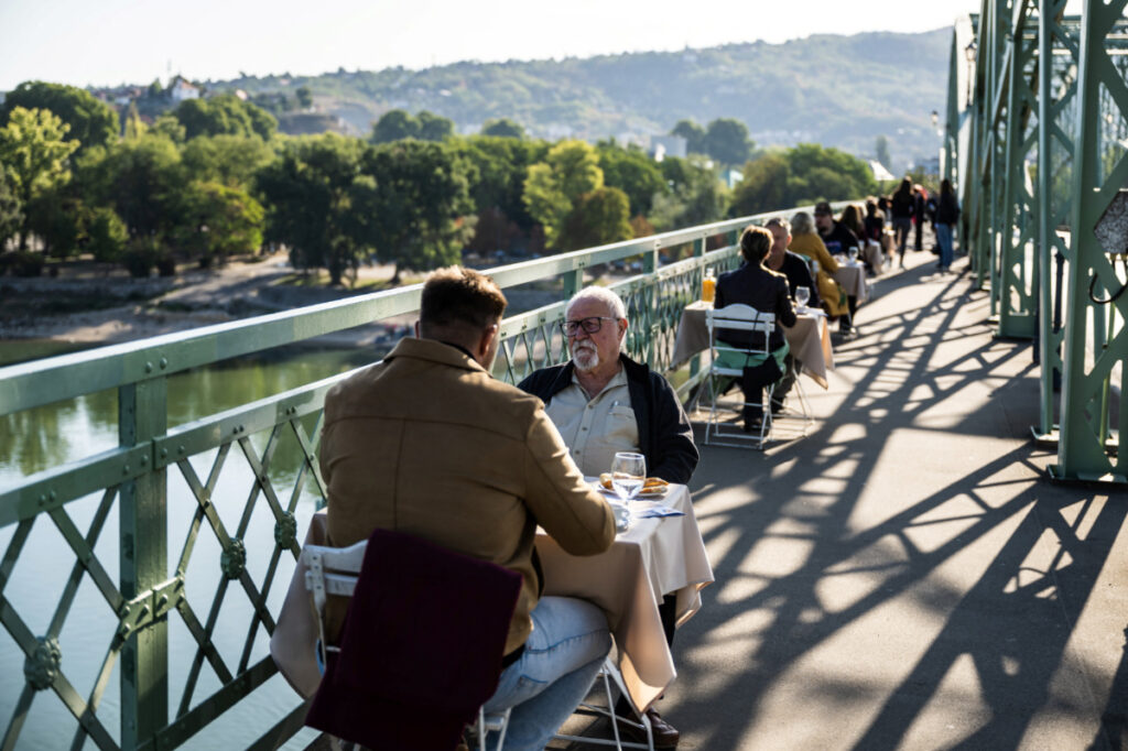 Hungarians and Slovaks share breakfast on Danube bridge that survived war and division
