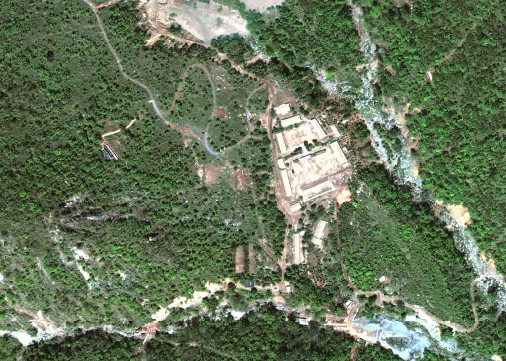 Overhead view of a forested landscape where nuclear testing occurred