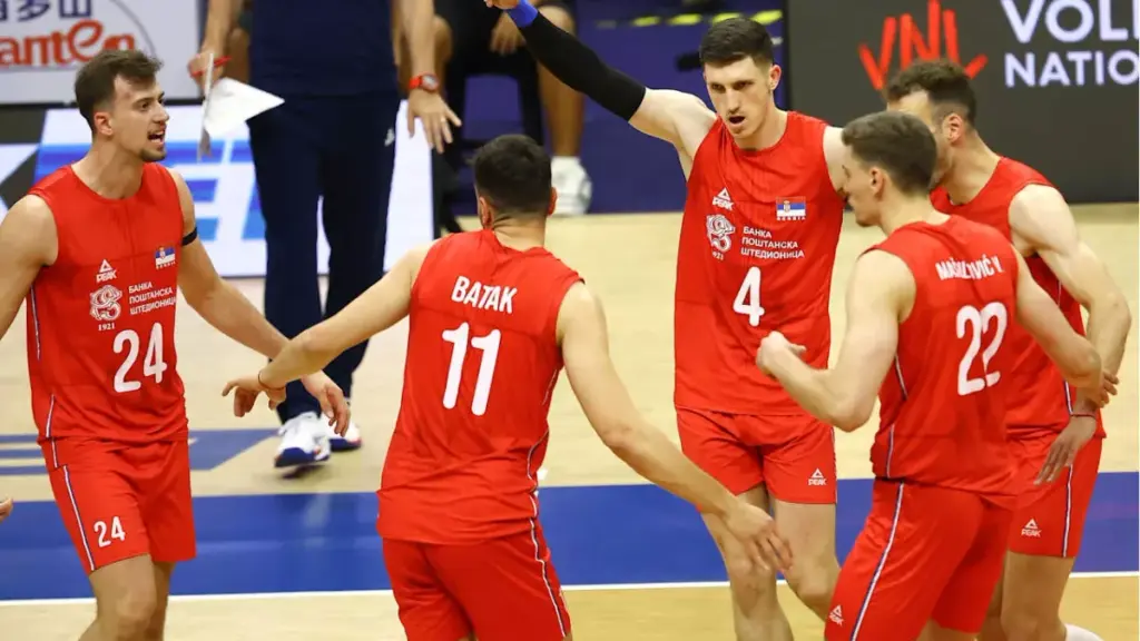 Serbia's volleyball players celebrate after beating Greece in the European Championship quarterfinal