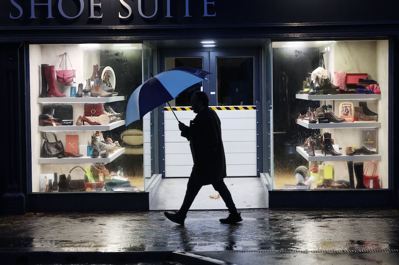 Flood defence barrier in place on a shop on Midleton's Main Street, Co Cork, in preparation for Storm Austen. Photograph: Alan Betson/The Irish Times