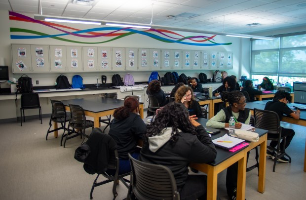 The colors of the Hartford HealthCare logo are painted on the walls of a classroom as students attend class at the Connecticut River Academy in East Hartford on Wednesday, Oct. 7, 2026. (Aaron Flaum/Hartford Courant)