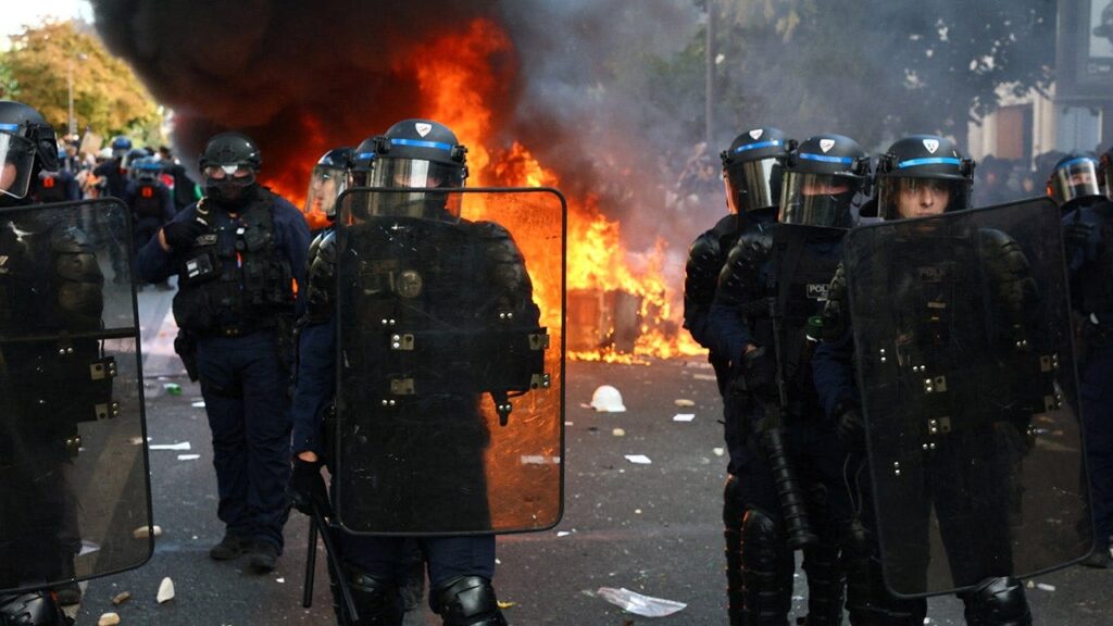 Macron heads to Kuwait for energy talks while France riots rage on