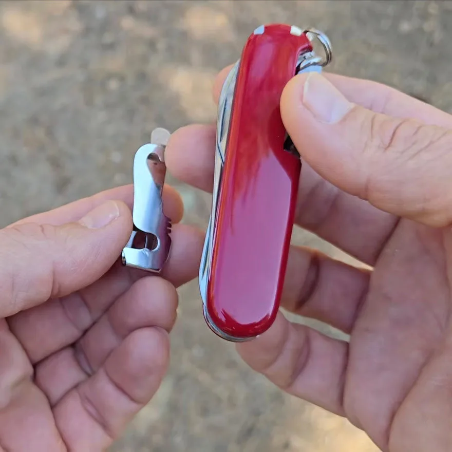 Tortoise Gear Reinvents the Swiss Army Knife with Clip-On Magic Detailed view of the swiss army knife clip in focus, highlighting its sturdy design.